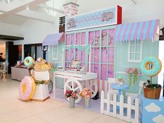 an ice cream shop is decorated in pastel blue and pink