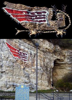 an image of a large bird with wings on it's back and the side of a building