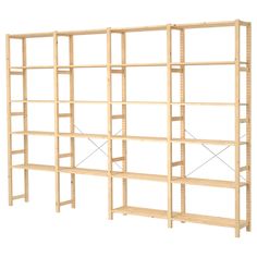 a wooden shelving unit with four shelves on one side and three rows on the other