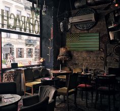 a restaurant with tables and chairs in front of an american flag hanging on the wall