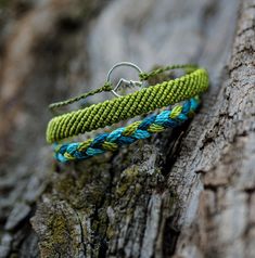 This hiking bracelet set is an adventure gift that any outdoor enthusiast will love. With a nature-inspired mountain bracelets featuring forest green colors, combined with a braided bracelet with contrast turquoise and a flat woven bracelet in grass green, this set is the perfect way to accessorize any outdoor adventure. Make a statement and provide a beautiful reminder of outdoor exploration and wanderlust with these Green life bracelets.  MATERIALS:  -Mountain charm made of alloy and zinc. -Th Hiking Bracelet, Outdoor Exploration, Mountain Destinations, Cord Set, Adventure Gifts, Forest Green Color, Woven Bracelet, Outdoor Enthusiast, Braided Bracelet