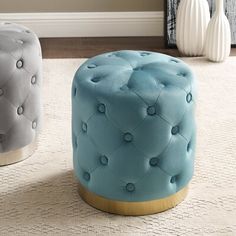 two stools sitting next to each other on a rug