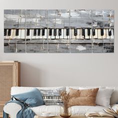 a living room with a couch, coffee table and piano on it's wall