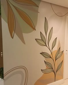 the wall is painted with leaves and circles on it's sides, along with a door