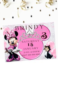 a minnie mouse birthday party with balloons and streamers