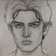 a pencil drawing of a man's face with short hair and eyes wide open