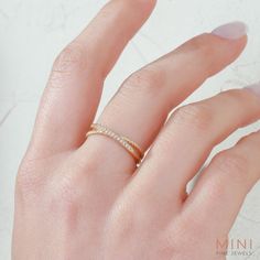 a woman's hand with a ring on it