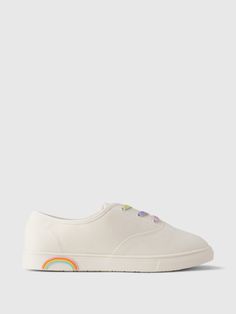 These sneakers are made with a smooth canvas upper.  Rubber gripper sole.  Lace-up styling.  Rainbow details.  For more fit and sizing info, check out our Size Guide. Rainbow Sneakers, Kids Rainbow, Rainbow Kids, Gap Kids, Up Styles, Size Guide, Gap, Lace Up, Rainbow