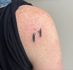 a person with a small tattoo on their arm