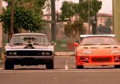 two cars parked next to each other on the street