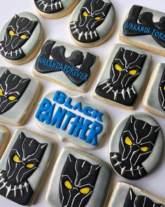 decorated cookies with black panther designs on them