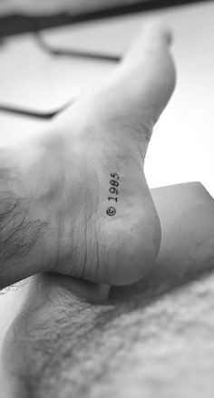 a person with a small tattoo on their foot