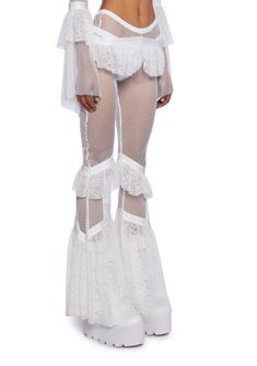 in this world, it's all about balance. These pants have a sheer fishnet construction, a high-rise waist with a strappy design, ruffled lace trim at the hips and knees, and a flared leg silhouette. Sheer White Pants, Festival Outfits Pants, All White Rave Outfit, White Costume Women, Countdown Rave Outfit, Hippie Rave Outfits, Sheer Pants Outfit, Rave Inspo Outfits, White Rave Outfits