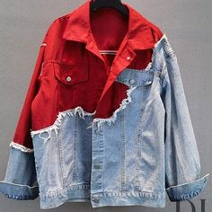 a red and blue jean jacket hanging on a clothes rack