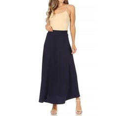 Product Description: Solid Color: This skirt comes in a single, solid color, which gives it a classic and versatile appearance. Common colors include black, navy, gray, or other neutral tones. High Waist: The high-waisted design means that the skirt's waistline sits above the natural waist. This style accentuates the waist and provides a flattering fit. It can also help create an elongated and elegant silhouette. Flare A-line: The skirt is cut in an A-line shape, which means it is fitted at the Moa Collection, Skirt With Elastic Waistband, Long Maxi Skirts, High Waisted Flares, Navy Gray, Feminine Look, Leather Mini Skirts, Neutral Tones, Women's Casual