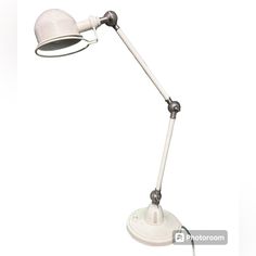 a white desk lamp on a white background with clippings to the left side