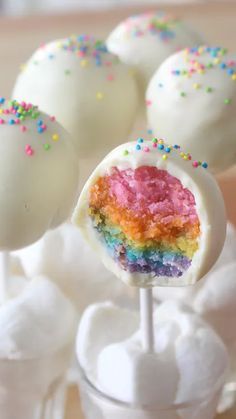 cake pops with rainbow frosting and sprinkles