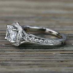 an engagement ring with a princess cut diamond in the center