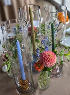 Beautiful Bud Vase and Taper Candle Rental Centerpiece containing Dahlias, Zinnias and Delphinium at the always gorgeous Onteora Mountain House. Dahlia Bud Vase Centerpiece, Dahlia Bud Vase, Delphinium Centerpiece, Bud Vase Centerpiece, Vase Centerpiece, Wedding Decorating, Vase Centerpieces, Wedding Professional, Delphinium