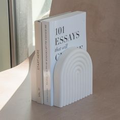 a book sitting on top of a table next to a window