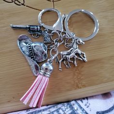 a pair of scissors and some charms on a table