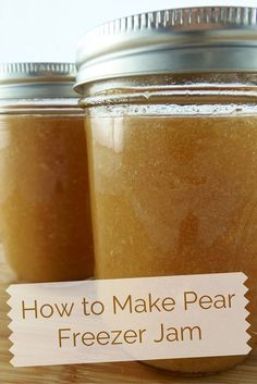 two jars filled with freezer jam sitting on top of a wooden table