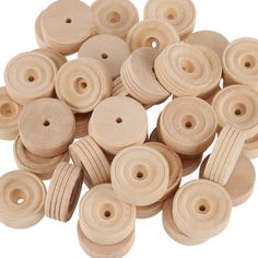 wooden buttons with holes in the middle are shown on a white background and there is no image here to provide a caption for