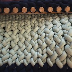 a large pile of white and black rope next to each other on top of a table