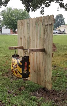 a wooden fence with a bag hanging from it