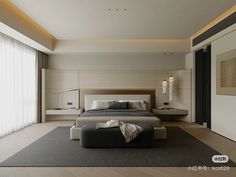 a large bed sitting in the middle of a bedroom next to a tall white wall