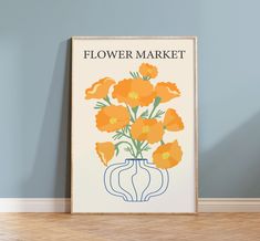 an orange flower market poster on the wall