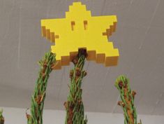 a yellow pacman head on top of a cactus