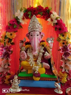 an elephant statue sitting on top of a table