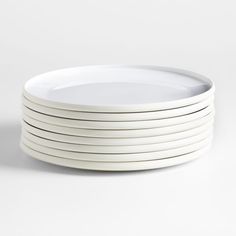 white plates stacked on top of each other