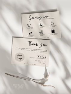 two thank cards sitting on top of each other