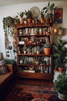 a bookshelf filled with lots of plants and potted plants next to a couch