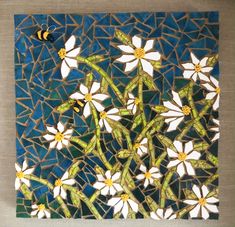 A stained glass mosaic created by Joetta Currie, featuring daisies and bumblebees. Fashioned with milk glass, beads, and gold wire. It comes ready to display in your home. Custom sizes available. Please contact the artist before purchasing. Teacup Planter, Greek Landscape, Sunflower Mosaic