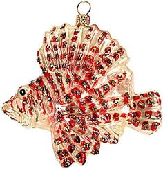 a glass fish ornament with red beads