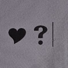 a t - shirt with a heart and question mark on it