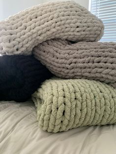 several blankets are stacked on top of each other