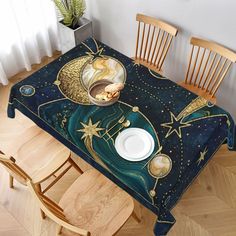 the table is covered with an artisticly designed blue and gold cloth, which has stars on it