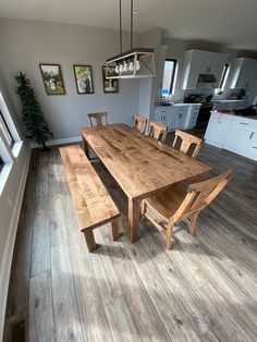 a wooden table and bench in a room