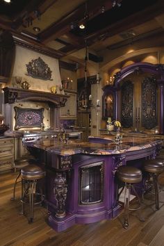 a large kitchen with an island in the middle and stools at the counter top