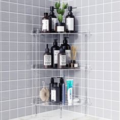 three tiered shelves in the corner of a bathroom