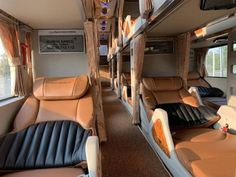 the inside of a train car with leather seats