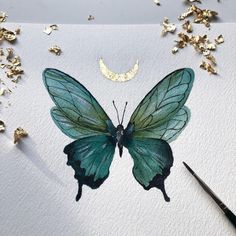 a painting of a blue butterfly with gold flakes on it's wings and a half moon in the background