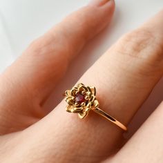 Flower Ruby Ring, Ruby Birthstone Ring For Promise, Ruby Ring With Round Band For Promise, Solitaire Ruby Ring For Promise, Promise Ruby Ring With Birthstone, Gift Ruby Ring With Lab-created Ruby Birthstone, Fine Jewelry Birthstone Flower Promise Ring, Promise Ruby Birthstone Ring In Fine Jewelry Style, Ruby Birthstone Ring For Promise Occasion