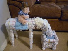 a teddy bear sitting on top of a toy horse next to another stuffed animal in front of a couch