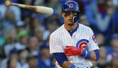 a baseball player holding a bat during a game