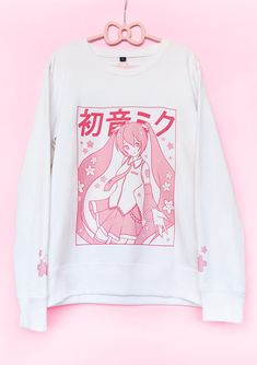 A pastel pink Sakura Miku Sweater, with a Yume Kawaii vibe!  Sweater color and design placement is most accurate to the 2nd picture!!  Printed via Direct-to-Garment method for a matte finish that blends well with the fabric without excess edges. American sizing! Size chart on the last image. ❤ 50% pre-shrunk cotton, 50% polyester ❤ Air-jet spun yarn with a soft feel and reduced pilling ❤ Lined with fleece inside for a soft texture  ❤ Double-needle stitched collar, shoulders, armholes, cuffs, and Pink Cotton Harajuku Style Hoodie, Pink Harajuku Style Cotton Hoodie, Pink Harajuku Cotton Hoodie, Kawaii Anime Print Winter Sweatshirt, Pink Harajuku Style Hooded Sweatshirt, Pink Harajuku Hooded Sweatshirt, Kawaii Anime Print Hooded Sweatshirt, Pink Harajuku Crew Neck Hoodie, Harajuku Style Pink Long Sleeve Sweatshirt